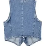 Back view of cropped button front denim vest on display, showcasing structured fit and classic denim design