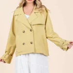 Woman wearing mittoshop double breasted trench coat jacket in a stylish city street outfit
