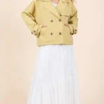 Woman wearing mittoshop double breasted trench coat jacket in a stylish city street outfit