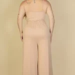 Back view of plus size wide leg jumpsuit with a smooth, relaxed fit, showcasing a clean silhouette and flowing fabric for an elegant and flattering drape