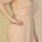 Close-up of plus size button front wide leg jumpsuit highlighting the front button detail, soft fabric texture, and tailored neckline for a polished and stylish look