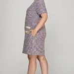 Side view of plus size pearl studded trim knit tweed dress on model, showing flattering shape and textured knit fabric