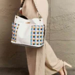 Model carrying Nicole Lee USA Quihn 3-piece handbag set styled with everyday outfit, showcasing chic designer tote and crossbody versatility