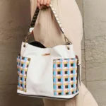 Model carrying Nicole Lee USA Quihn 3-piece handbag set styled with everyday outfit, showcasing chic designer tote and crossbody versatility