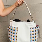 Model holding Nicole Lee USA Quihn tote handbag back view, showcasing clean structured design and stylish everyday fashion look