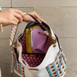 Interior of Nicole Lee USA Quihn tote bag displaying organized compartments, zip pockets, and roomy storage for everyday essentials