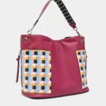 Side angle view of Nicole Lee USA Quihn tote handbag highlighting structured silhouette, spacious interior width, and sleek everyday design