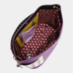 Interior of Nicole Lee USA Quihn tote bag displaying organized compartments, zip pockets, and roomy storage for everyday essentials